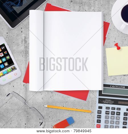 Blank note pad with office and business work elements around