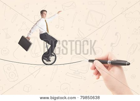 Businessman riding monocycle on a rope drawn by hand concept