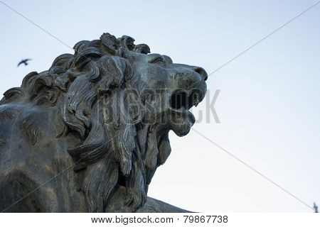 Bronze lion sculpture, oldest street in the capital of Spain, the city of Madrid