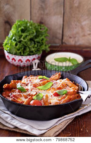 Pasta bake with penne, tomatoes and mozarella