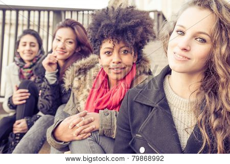 Four Young Beautiful Girls Smiling