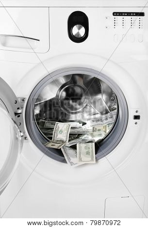 Money in washing machine, closeup view