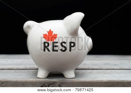 Canadian Registered Education Savings Plan, Resp Concept With White Piggy Bank