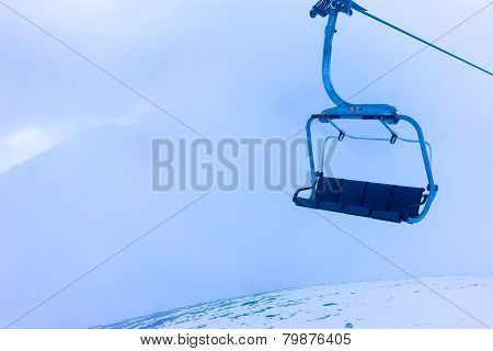 Empty Ski Lift Over The Snowed Mountain
