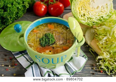 Shchi - Traditional Russian Cabbage Soup On A Wooden Table