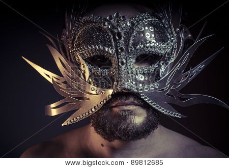 Treasure, jewels and silver. Man with mask of precious metals