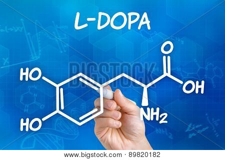 Hand With Pen Drawing The Chemical Formula Of L-dopa