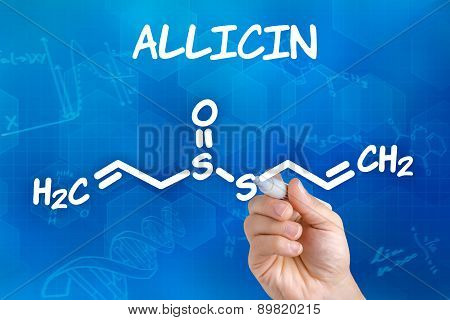 Hand With Pen Drawing The Chemical Formula Of Allicin