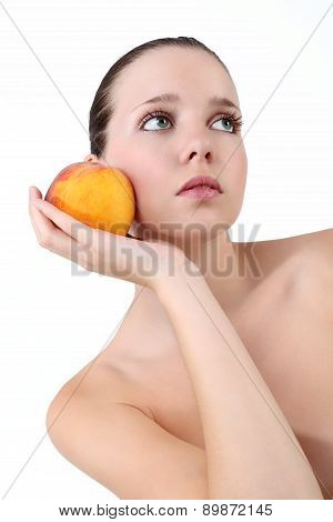 Beautiful Young Woman with Fresh Clean Skin, He is holding a peach near the face, on white backgroun