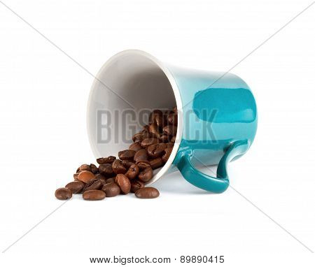 Cup with coffee beans on white background