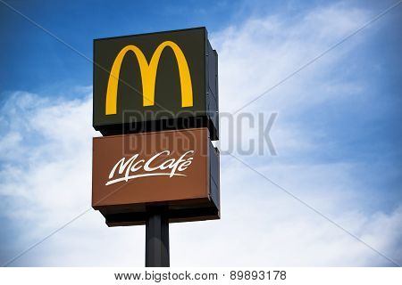 Mcdonalds And Mccafe Signs On Post