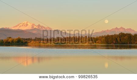 Full Blue Moon Over Mt. Baker And Three Sisters Mountain