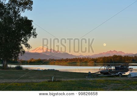 Full Blue Moon Over Mt. Baker And Three Sisters Mountain