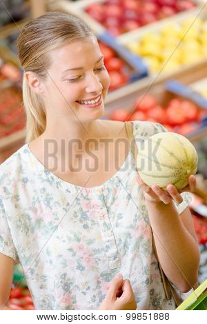 Woman picking a melon