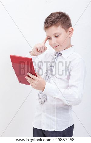 Portrait of teen boy with calculator on white background
