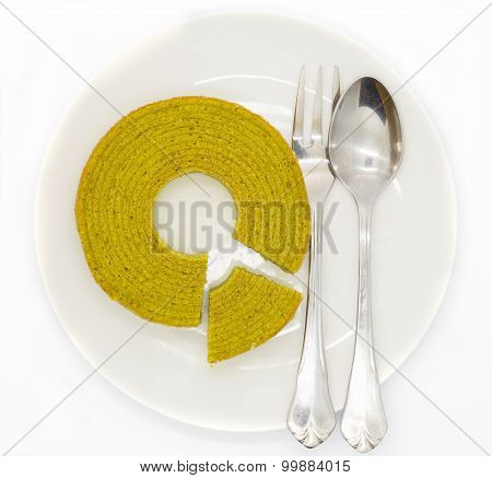 Multiple layers green tea cake on wooden disk