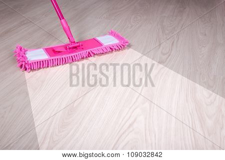 Cleaning, Before And After Concept - Wooden Floor With Pink Mop