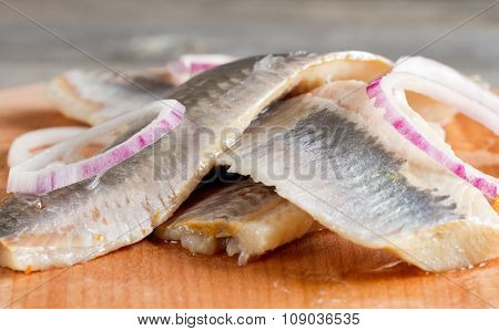 Pieces Of Herring Fillet On A Cutting Board