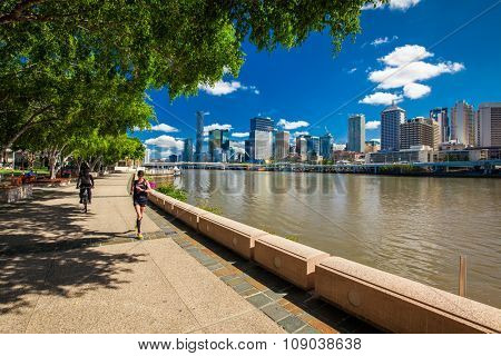 BRISBANE, AUS - NOV 18 2015: River walk in South Bank Parkland. It's inner-city man-made beach next to city center.