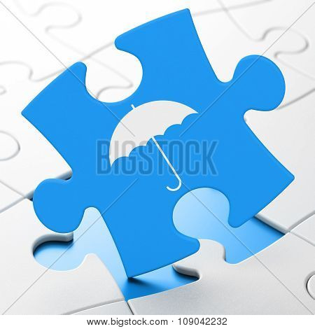 Security concept: Umbrella on puzzle background