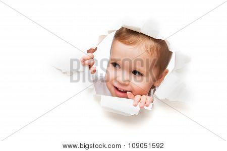 Funny  Child Baby Girl Peeping Through Hole In An Empty White  Paper