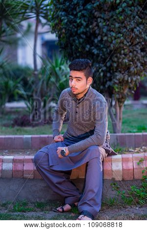 Portrait Of Young Man Urban Background With Modern Haircut