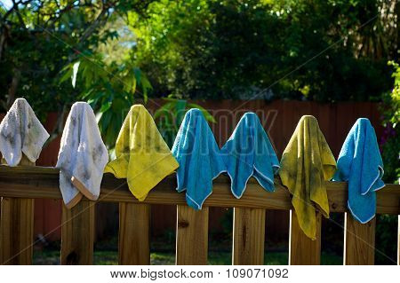 Dirty Rags Hanging On Fence