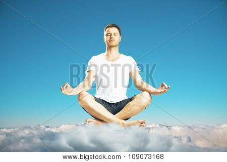 Man Maditates On The Clouds At Blue Sky Background Concept