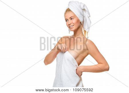 Young attractive woman with blue eyes in a towel