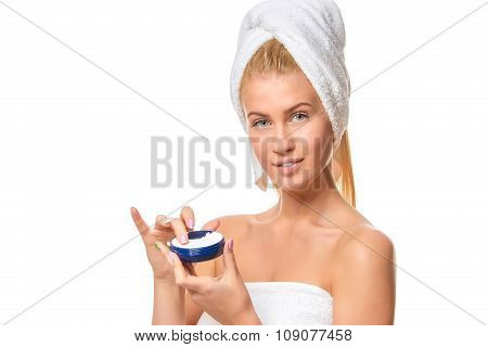 Beautiful spa girl holding jar of cream isolated on white