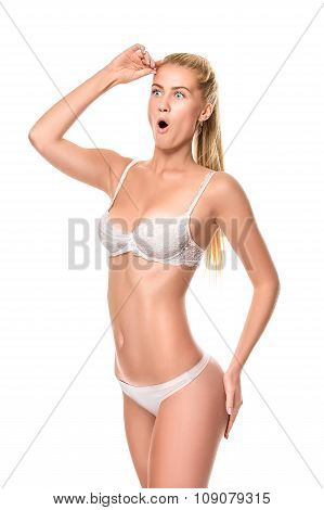Young blonde woman wearing white underwear isolated over light b