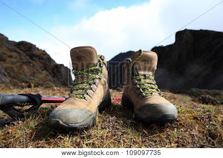 hiking boots on mountain peak