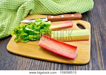 Rhubarb With Knife And Napkin On Board