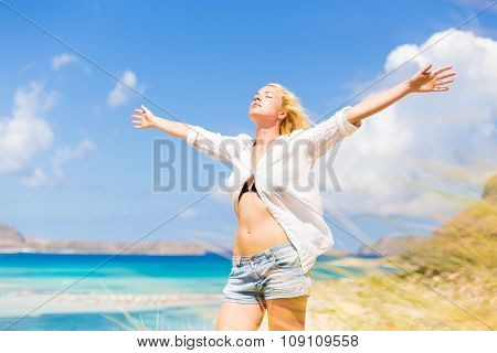 Free Happy Woman Enjoying Sun on Vacations.