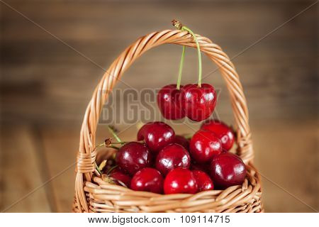 Ripe Sweet Red Cherries in Wicker Basket