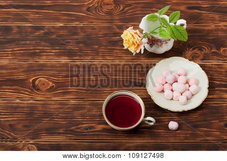 Tea Cup and Plate Of Fine Bone China. Sweets. Rose. Burnt Wooden