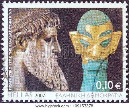 GREECE - CIRCA 2007: Stamp shows Zeus of Artemision statue and bronze sculpture with golden mask