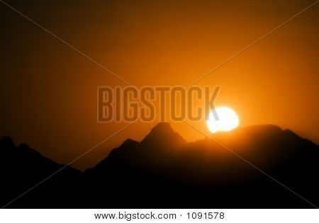 Sunset In Mountains