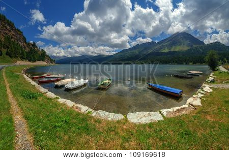 Amazing sunny day at Champferersee lake in the Swiss Alps. Silvaplana village, Switzerland, Europe.