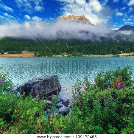 Amazing sunny day at Champferersee lake in the Swiss Alps. Silvaplana village, Switzerland, Europe.