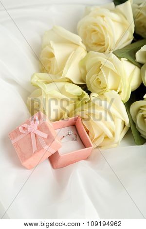 Bouquet Of White Roses On White Fatin