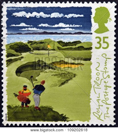 A stamp printed in Great Britain shows Golfers with inscriptions 