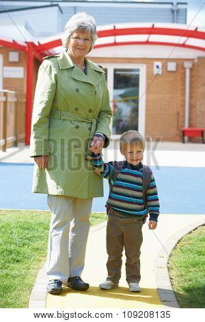 Grandmother Taking Grandson To School