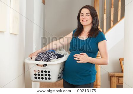 Pregnant Woman Doing Chores At Home