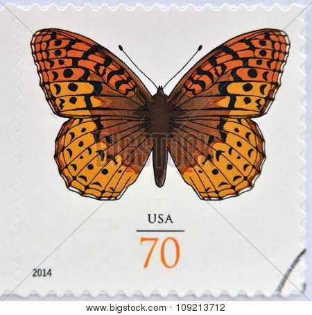 A stamp printed in USA shows Great Spangled Fritillary Butterfly circa 2014