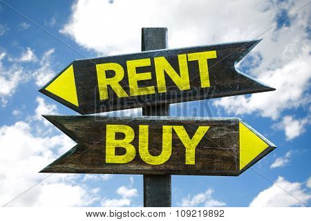 Rent - Buy signpost with sky background