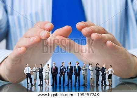 Large group of business people protected with hands 