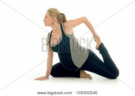 Pregnant woman doing sport exercises in yoga style