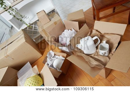 Moving boxes in new house. New apartment background.