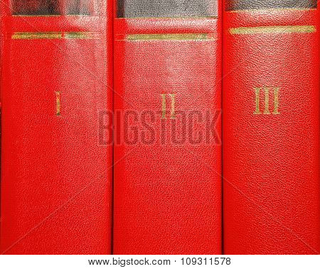 Volumes Of Old Books With Gold Lettering On The Cover